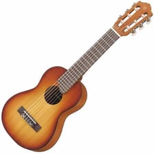A small guitalele instrument with a guitar-like body