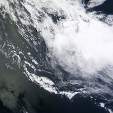 Circular currents forming a whirlpool in water.