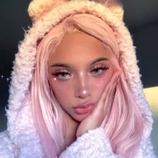 A young person displaying makeup and fashion associated with the e-girl aesthetic.