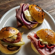 A small slider sandwich served on a soft bun.