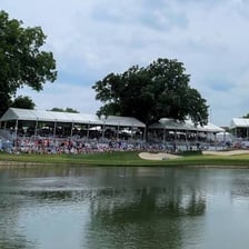 Professional golfers competing in a PGA event on a golf course