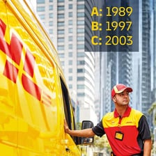 A DHL delivery truck in the company’s red-and-yellow branding