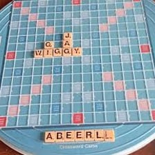 A Scrabble blank tile shown beside lettered tiles.