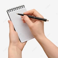 A person quickly writing notes in a notebook