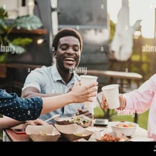 A person enthusiastically eating a meal