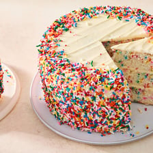 A cake covered with colorful Funfetti sprinkles