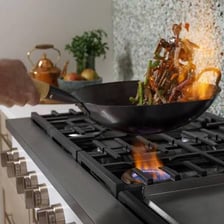 A kitchen rangetop with multiple burners.
