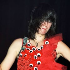 Karen O performing with the indie rock band Yeah Yeah Yeahs.