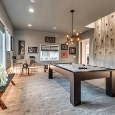 A home recreation room with space for games and leisure.