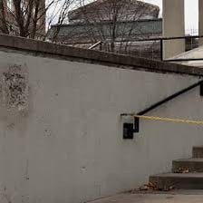 A building ledge projecting outward from a flat wall