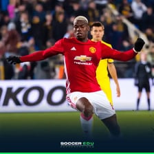 A soccer player positioned in midfield.