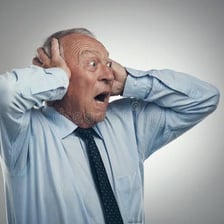A person reacting with visible surprise or exasperation.