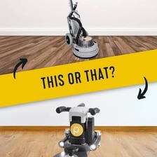 A floor installer kneeling while working on a floor.