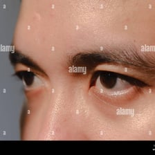 A close-up view of a person’s eyes.