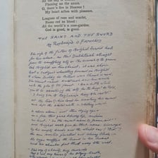 An open book displaying a poem