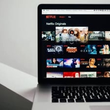 An online video episode playing on a laptop