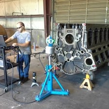 Engineers disassembling and rebuilding a machine during an overhaul.