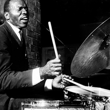 Musicians performing with a strong rhythmic feel.