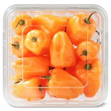 Several bright orange habanero peppers.