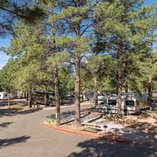 An RV parked at a KOA campground.