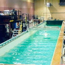 A long laboratory tank generating waves for coastal research.
