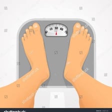 A person standing on a bathroom scale.