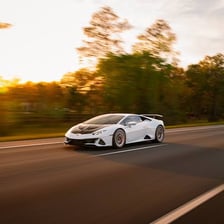 A fast car traveling on a highway.