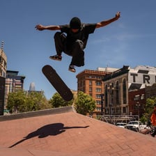 A skateboarder riding through a skate park.