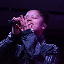 Singer Ella Mai performing onstage.