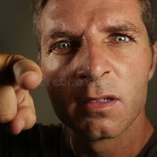 A close-up portrait shows a person expressing intense emotion.