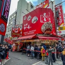 A lively Osaka street scene associated with the city’s food culture