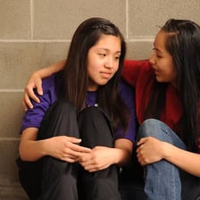 A person showing concern while helping another person