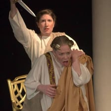 A stage production depicting the assassination scene from Julius Caesar
