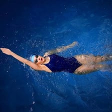 A swimmer performing the backstroke