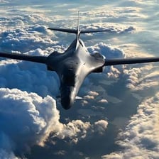 A United States Air Force aircraft flying among clouds