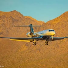 A Gulfstream private jet on an airport runway