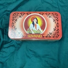 Sun-Maid raisins packaging featuring the girl in a red bonnet