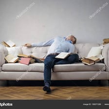 A tired person sitting sluggishly on a couch.