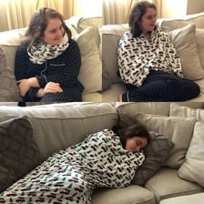 A person comfortably wrapped in a blanket.