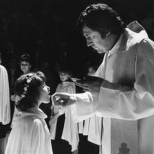 A Christian Communion ceremony taking place in a church.