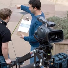 A film crew recording a scene on a set.
