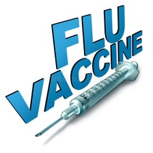 A syringe beside an influenza vaccination illustration