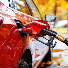 A car being refueled at a gas station.