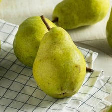 A ripe pear showing its wider bottom and narrower top