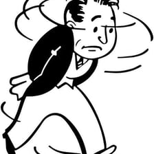 A worried person walking back and forth indoors.