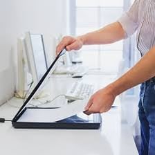 A person examining a document carefully