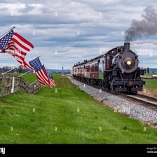 A locomotive traveling along a railroad track.