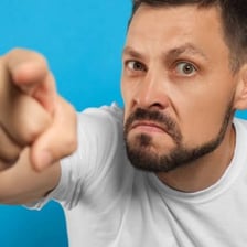 Dramatic depiction of a person confronting someone for revenge