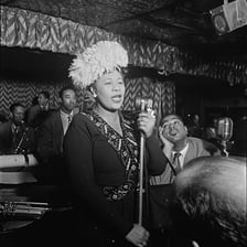Ella Fitzgerald performing as a jazz vocalist.
