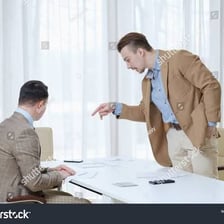 A manager giving instructions to an employee